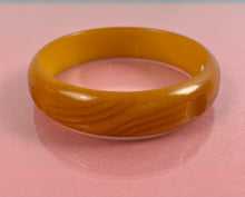 Load image into Gallery viewer, Art Deco Carved Butterscotch Bakelite Bangle

